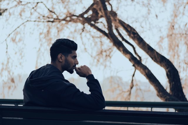 man-in-black-hoodie-sitting-on-bench-near-green-trees-819635 (1).jpg