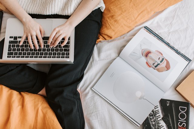 unrecognizable-woman-typing-on-laptop-in-bed-4050407.jpg