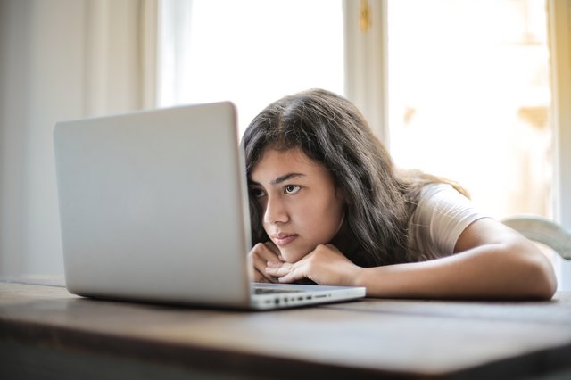 young-woman-using-laptop-at-home-3807747.jpg